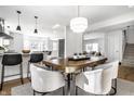 Bright and airy dining area with a view into the kitchen and sitting room at 41 White Lick Dr, Indianapolis, IN 46227