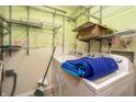 Practical laundry room with wire shelving and in-unit washer and dryer at 4247 Larkspur Trce, Indianapolis, IN 46237