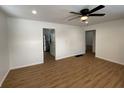 Bright living room with wood flooring and a ceiling fan at 6018 Ivanhoe St, Indianapolis, IN 46219