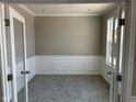 Office with decorative trim and french doors at 640 Firefly Ct, Greenfield, IN 46140