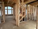 Staircase showcasing a well-lit interior, with framing and window at 640 Firefly Ct, Greenfield, IN 46140