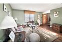 Comfortable living room showcasing hardwood floors, artwork, and stylish furniture at 6740 Live Oak Ct, Indianapolis, IN 46214