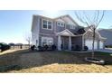 Charming home with a well-manicured lawn and stylish gray siding at 7139 Prelude Rd, Brownsburg, IN 46112
