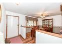 Cozy dining room featuring a ceiling fan and wood flooring at 7808 Crossgate Ln, Southport, IN 46227