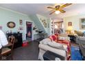 Cozy living room featuring classic decor, ceiling fan, and hardwood flooring at 7968 E 200 S, Whitestown, IN 46075
