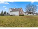 Exterior view of the home's side yard on a sunny day at 845 Harvest Lake Dr, Brownsburg, IN 46112