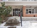 Inviting front porch featuring decorative columns, cozy seating, and charming details perfect for relaxing outdoors at 102 N Bosart Ave, Indianapolis, IN 46201