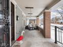 Cozy front porch with comfortable seating and ambient lighting, ideal for enjoying the neighborhood views and outdoor living at 102 N Bosart Ave, Indianapolis, IN 46201