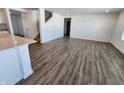 Open-concept living area with hardwood floors, a staircase, and lots of natural light at 11322 N Quillow Way, Monrovia, IN 46157
