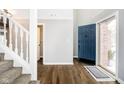 Inviting entryway with hardwood floors and a staircase leading to the upper level at 13895 Silver Stream Dr, Carmel, IN 46032