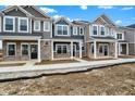 Beautiful townhomes showcasing varied textures, complementary colors, and inviting front entrances at 19517 Grassy Branch Rd, Westfield, IN 46074