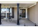 Inviting front porch with seating, decorative accents, and a welcoming entrance at 3037 Knobstone Ln, Indianapolis, IN 46203