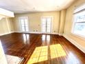 Spacious living room with hardwood floors and abundant natural light at 3236 Central Ave, Indianapolis, IN 46205