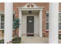 The home's front entry shows brick facade, decorative door frame and an elegant door at 387 Legacy Blvd, Greenwood, IN 46143