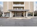 Exterior view of the modern entrance of this condo building, with glass doors and covered entryway at 3965 N Meridian St # Apt 2D, Indianapolis, IN 46208