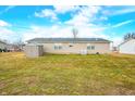 Expansive backyard featuring green lawn and storage shed at 480 Tague St, Greenfield, IN 46140