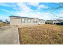 Traditional single-story home featuring light siding, well-maintained landscaping, and a cozy atmosphere at 480 Tague St, Greenfield, IN 46140