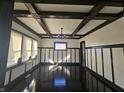 Elegant living room featuring dark wood floors, coffered ceilings, and decorative wall panels at 526 N Oxford St, Indianapolis, IN 46201