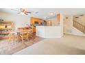 Eat-in kitchen featuring a dining table and a view into an adjacent living area at 5638 Congressional Pl, Indianapolis, IN 46235