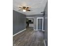 Open-concept space features new flooring and a view into the adjacent kitchen at 724 E Beecher St, Indianapolis, IN 46203