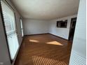 Bright living room featuring wood flooring, window and an open layout for a modern, airy feel at 806 Country Ln, Anderson, IN 46013