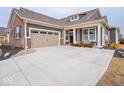Charming single-Gathering home with attached two-car garage and long concrete driveway at 8660 Hudson Way, Brownsburg, IN 46112