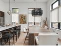 Elegant dining area with stylish lighting and ample seating for entertaining at 877 N East St # 103, Indianapolis, IN 46202