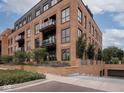 Beautiful brick condominium with lush landscaping and a private garage entrance at 877 N East St # 103, Indianapolis, IN 46202