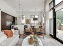 Bright and airy living room with large windows and modern decor at 877 N East St # 103, Indianapolis, IN 46202