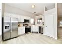 Bright kitchen features stainless steel appliances, white cabinetry, and plenty of space for meal preparation and casual dining at 10669 Springston Ct, Fishers, IN 46037