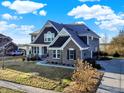A picturesque two-story home featuring a brick facade and a spacious three car attached garage at 1083 Margate Dr, Greenwood, IN 46143
