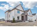Two-story home showing brick entryway, manicured lawn, and modern exterior finishes at 15969 Sonnet Park Ln, Westfield, IN 46074