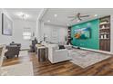 Inviting living room with sleek hardwood floors and a vibrant accent wall at 234 N State Ave, Indianapolis, IN 46201
