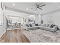 Spacious living room featuring hardwood floors and modern sectional sofa at 234 N State Ave, Indianapolis, IN 46201