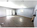 Open floor plan featuring new floors, sliding glass doors, and neutral paint at 401 W Edwards Ave, Indianapolis, IN 46217