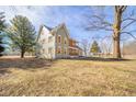 Charming two-story home featuring a delightful front porch and a well-maintained, expansive yard at 4981 E County Road 200 S, Avon, IN 46123