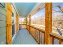 Inviting porch with wood railing and beams, offering scenic views of the surrounding landscape at 4981 E County Road 200 S, Avon, IN 46123