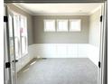 Cozy office space with wainscoting, carpet, and natural light from the windows at 618 Firefly Ct, Greenfield, IN 46140