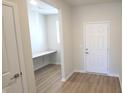 Study featuring a built in desk and wood flooring. Natural light floods this cozy space at 6887 Seabiscuit Rd, Whitestown, IN 46075