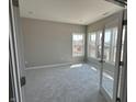 Bright office featuring neutral walls, plush carpet, and multiple windows for natural light at 750 Oakleaf Dr, Greenfield, IN 46140