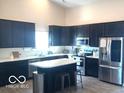 Well-equipped kitchen with island, ample cabinet space, and modern appliances at 10217 Caprock Canyon Dr, Indianapolis, IN 46229