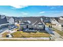 Inviting single-Gathering home showcasing a neatly landscaped yard, complemented by a wide driveway at 10590 Gardner Ct, Fortville, IN 46040