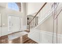 Elegant foyer featuring a grand staircase, hardwood flooring, and a welcoming entrance with ample natural light at 14085 Honey Tree Dr, Carmel, IN 46032