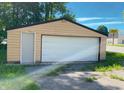 Detached garage with a single door and side entrance, offering convenient parking and storage space at 210 S West St, Paragon, IN 46166