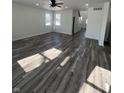 Bright, open living room featuring hardwood floors and large windows providing ample natural light at 2819 Walker Ave, Indianapolis, IN 46203