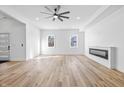 Spacious, bright living room with modern fireplace and hardwood floors at 3238 Guilford Ave, Indianapolis, IN 46205