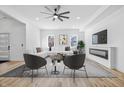 Bright living room with modern furniture, fireplace, and lots of natural light at 3238 Guilford Ave, Indianapolis, IN 46205
