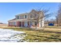 Spacious two-story home with a covered front porch and a well-maintained lawn at 3492 S 600 W, Anderson, IN 46011