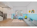 Bright playroom with carpeted floors, ample natural light, and a fun, inviting atmosphere at 4345 Indigo Walk Ln, Indianapolis, IN 46239