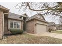 Lovely single-Gathering home with a well-kept lawn and a convenient two-car garage at 613 Brook Dr, Greenwood, IN 46143